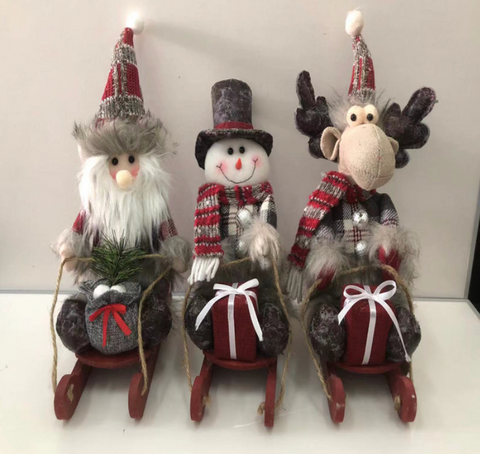 CHRISTMAS SOFT TOYS ON A WOODEN SLEDGE