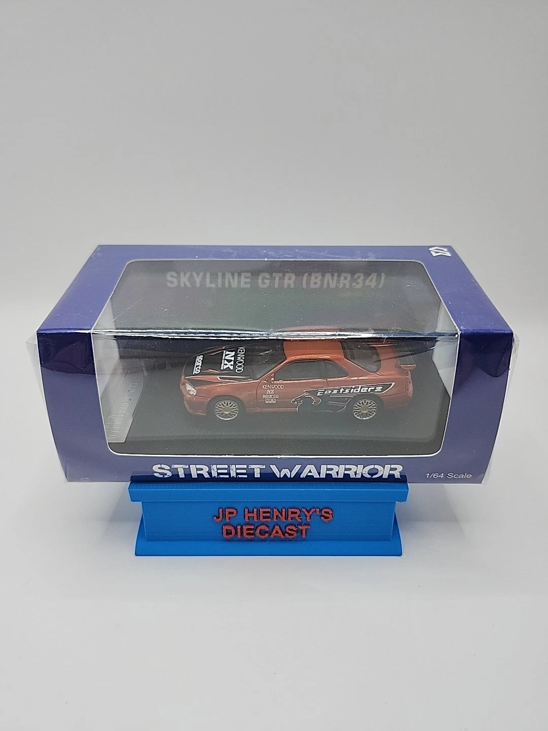 1:64 Street Warrior Skyline GTR (BNR34) Orange Kenwood Eastsiders