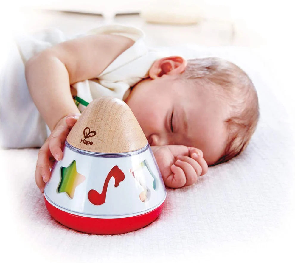 Hape Baby Musical Rotating Toy with Gentle Sound, Light Glow & Rolling Action – Early Learning Sensory Toy for Infants