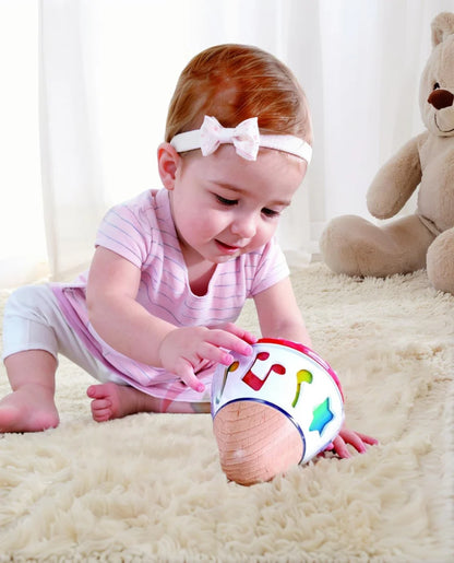 Hape Baby Musical Rotating Toy with Gentle Sound, Light Glow & Rolling Action – Early Learning Sensory Toy for Infants