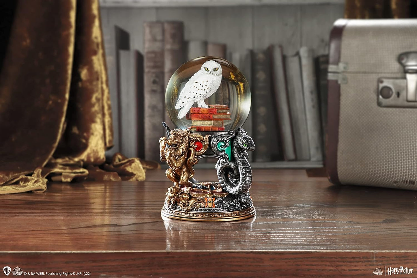 Hedwig Harry Potter Snow Globe with Hogwarts House Emblems Magical Collectible Piece