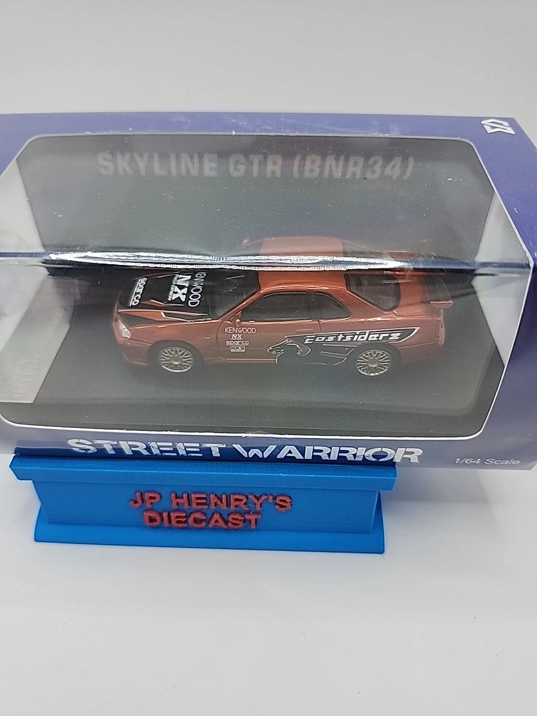1:64 Street Warrior Skyline GTR (BNR34) Orange Kenwood Eastsiders